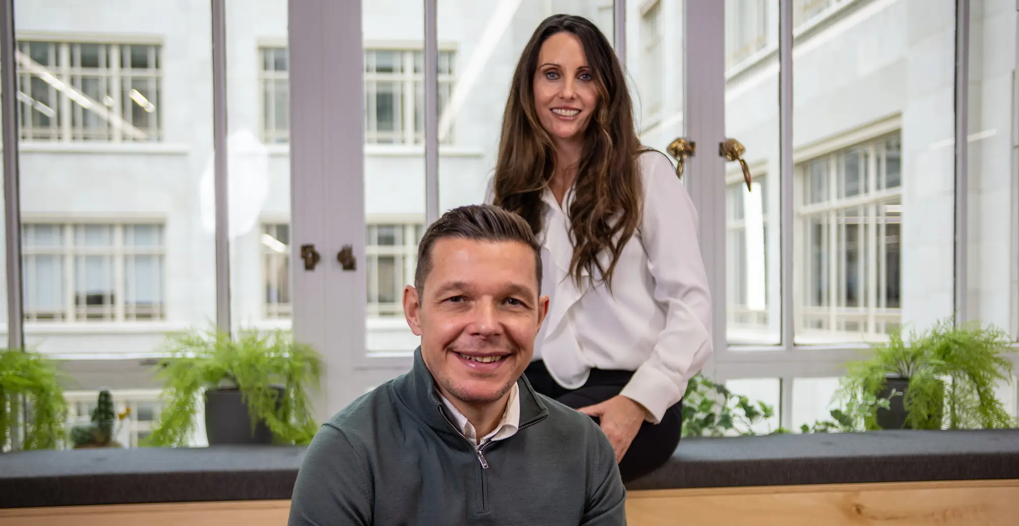 Happy family with mortgage advisor